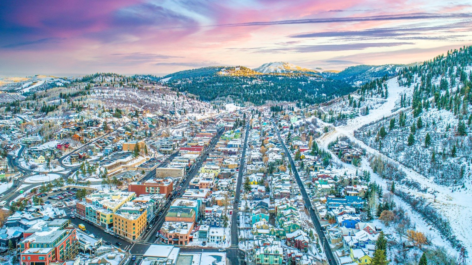 Aerial view of Park City Utah luxury resorts, high‑end HOAs, and mountain‑climate neighborhoods needing premium asphalt paving, sealcoating, crack sealing, and long‑term pavement maintenance services