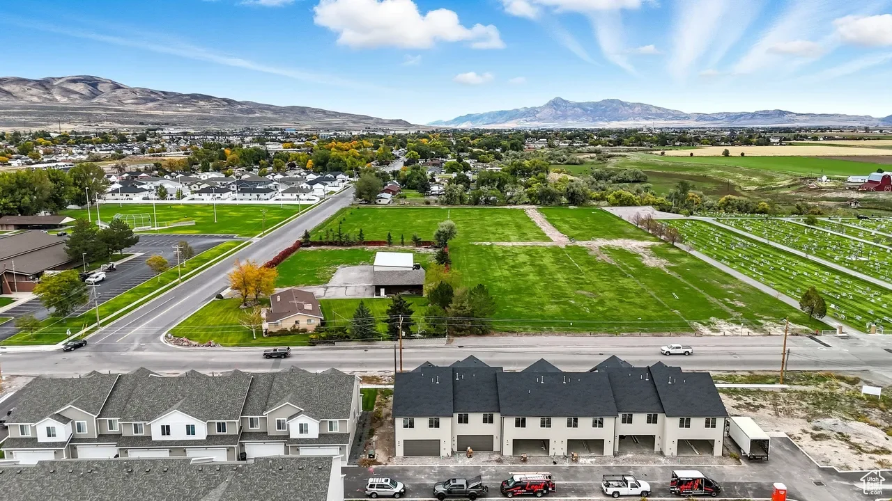 Tremonton Utah cemetery, LDS meetinghouse, and new townhomes with views north toward Idaho, near residential and commercial areas served by asphalt paving, repair, and maintenance services.