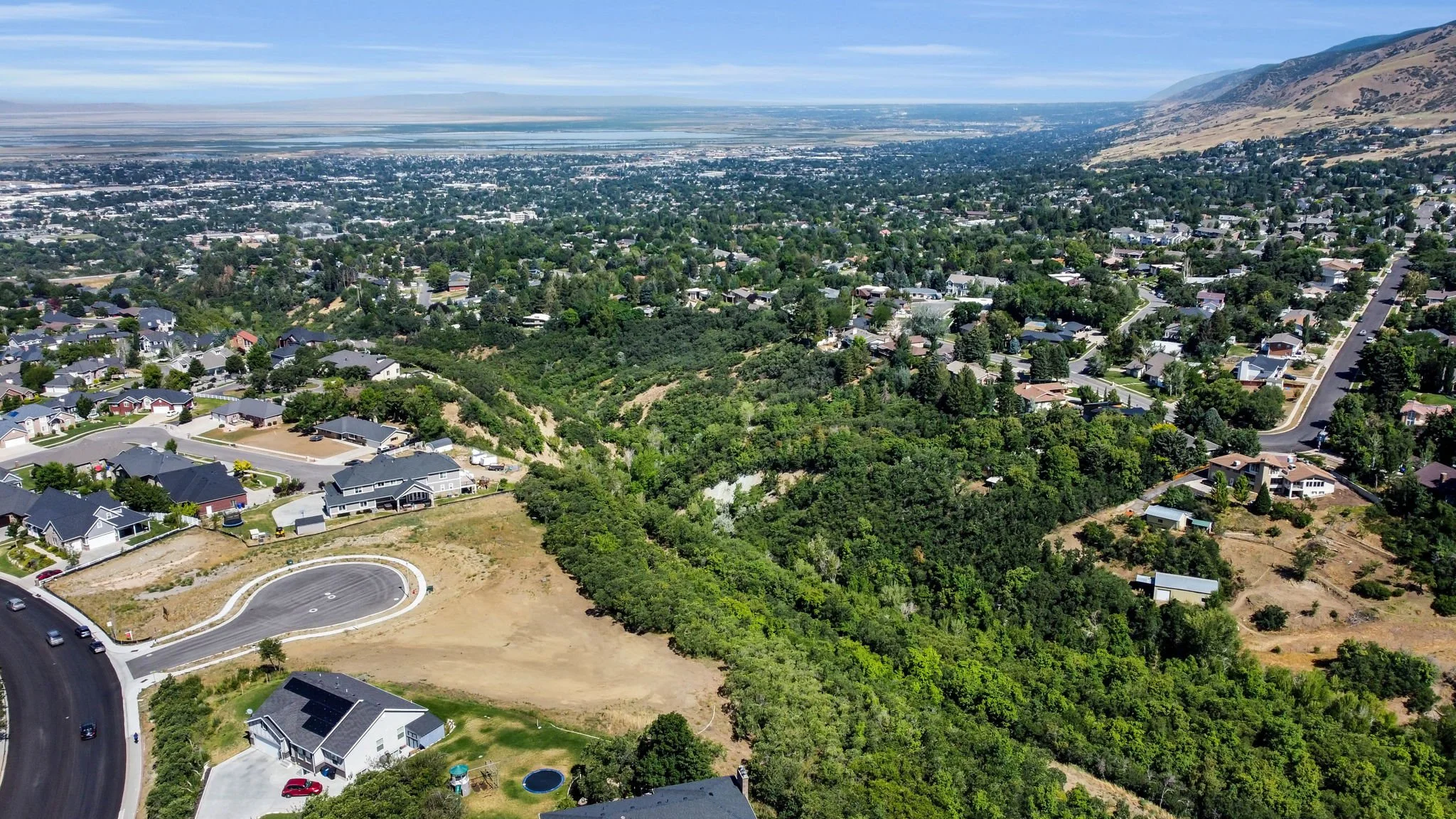 Mueller Park Canyon overlook in Bountiful Utah with views toward the Great Salt Lake, near residential and commercial areas served by asphalt paving, repair, and maintenance services.
