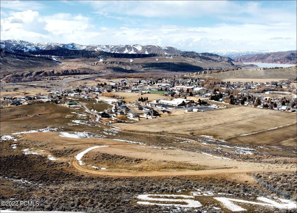 NS hillside letters above Coalville Utah looking west toward town with Echo Reservoir visible in the distance, serving nearby residential, commercial, and rural properties with asphalt paving, repair, and maintenance services.