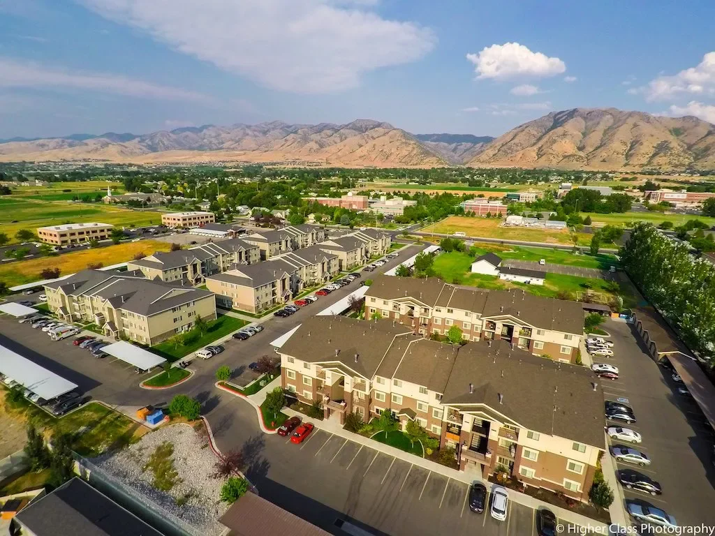 Logan Utah townhome community looking east toward the north–south mountain range along Cache Valley, near residential and commercial areas served by asphalt paving, repair, and maintenance services.