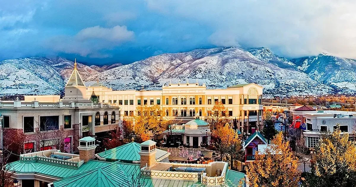 Station Park in Farmington Utah on a winter day with snow‑covered mountains, near residential and commercial areas served by asphalt paving, repair, and maintenance services.