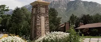 Holladay City Monument sign and surrounding foothill neighborhoods — representing local asphalt paving, repair, and maintenance services.