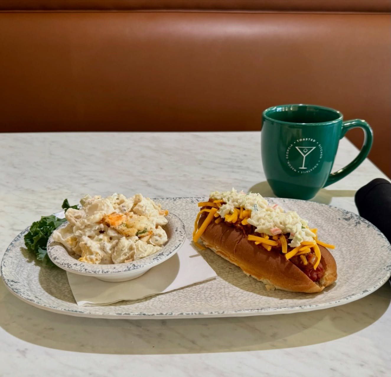 Another warm and cozy addition to our Sweater Weather menu! 🌭

The Loaded Hot Dog comes piled high with chili, cheese, mustard, diced onions, and coleslaw, with your favorite side right there next to it.