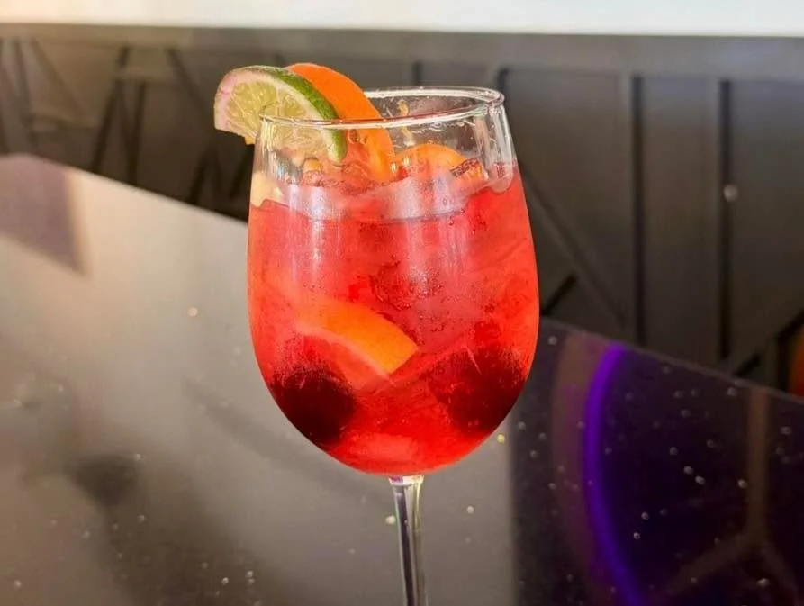 NEW Seasonal Sangria featuring cherries, oranges, cranberries, lemon + lime. Tastes like springtime in a glass. 🍹