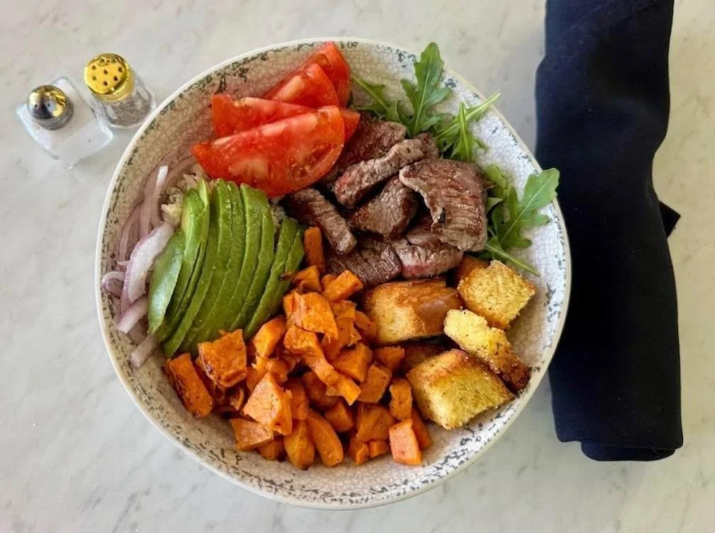Sneak out of the office for a tasty midweek lunch. 🤫
 
The Black N' Blue Salad - beef tenderloin, arugula, sweet potato, red onion, tomato, avocado, croutons, blue cheese crumbles + blue cheese dressing. Available on our spring specials menu!