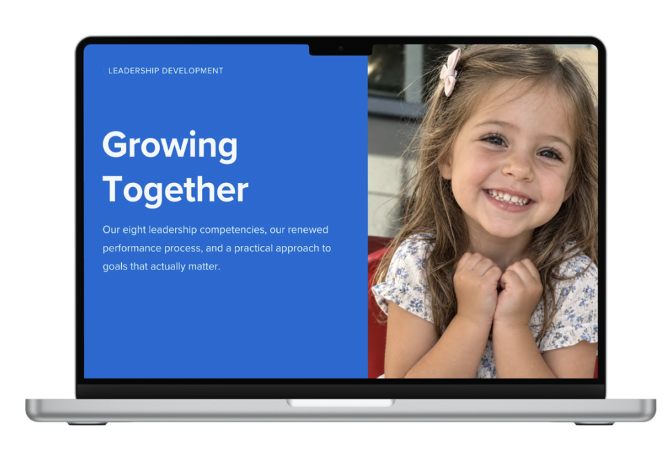 A laptop displaying a presentation slide titled 'Growing Together' with a photo of a smiling young girl with long hair and a bow in her hair.