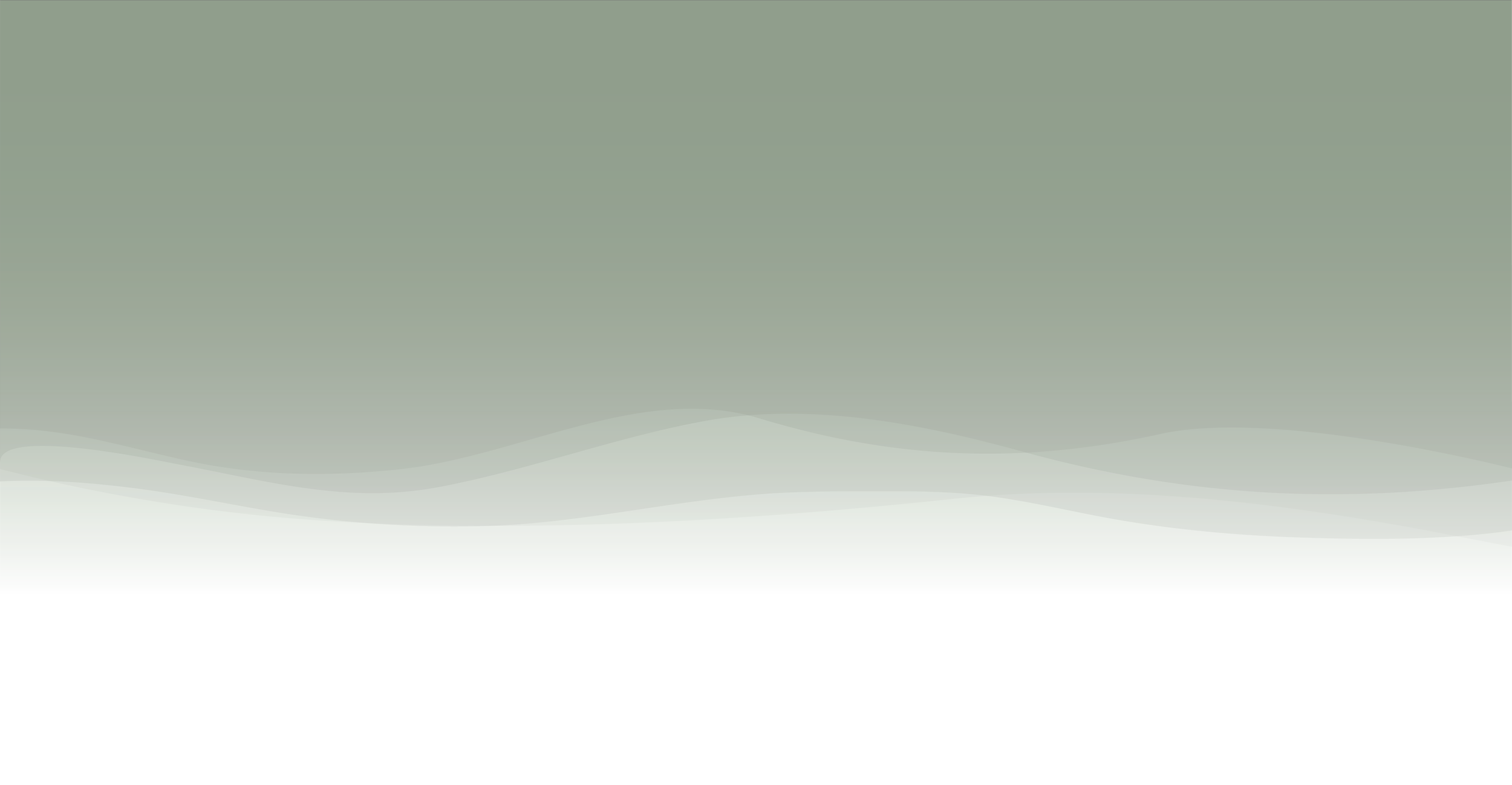 A landscape with a greenish sky, distant mountains, and a flat, grassy foreground.