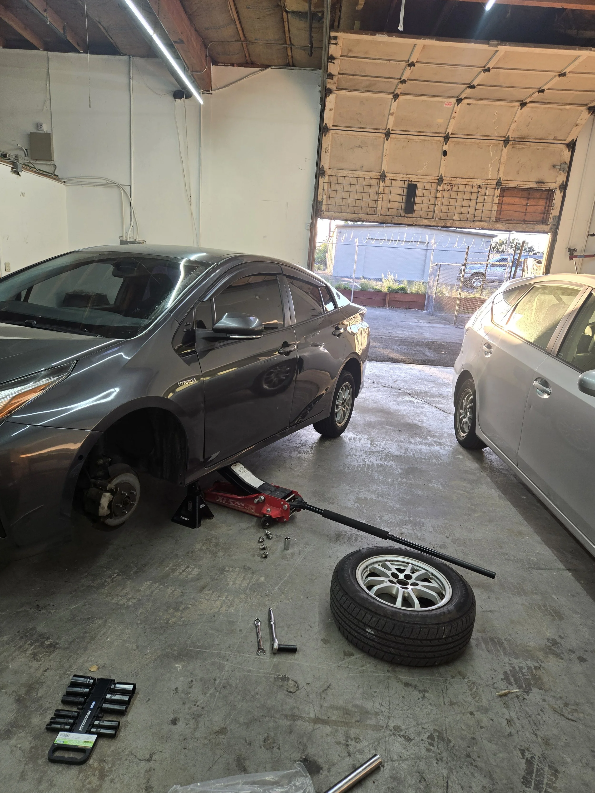 grey prius with tire off.jpg