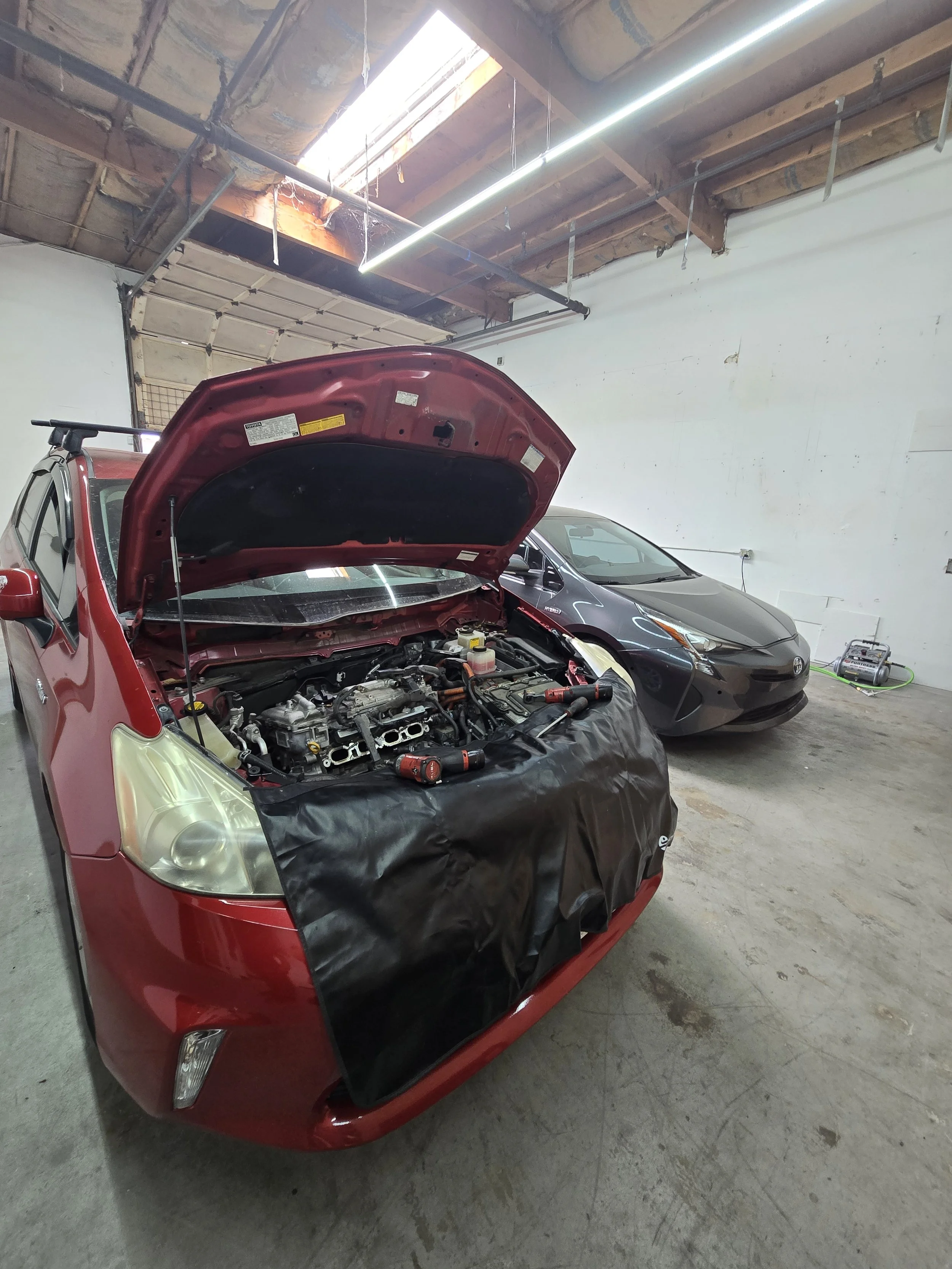 red prius inside shop.jpg