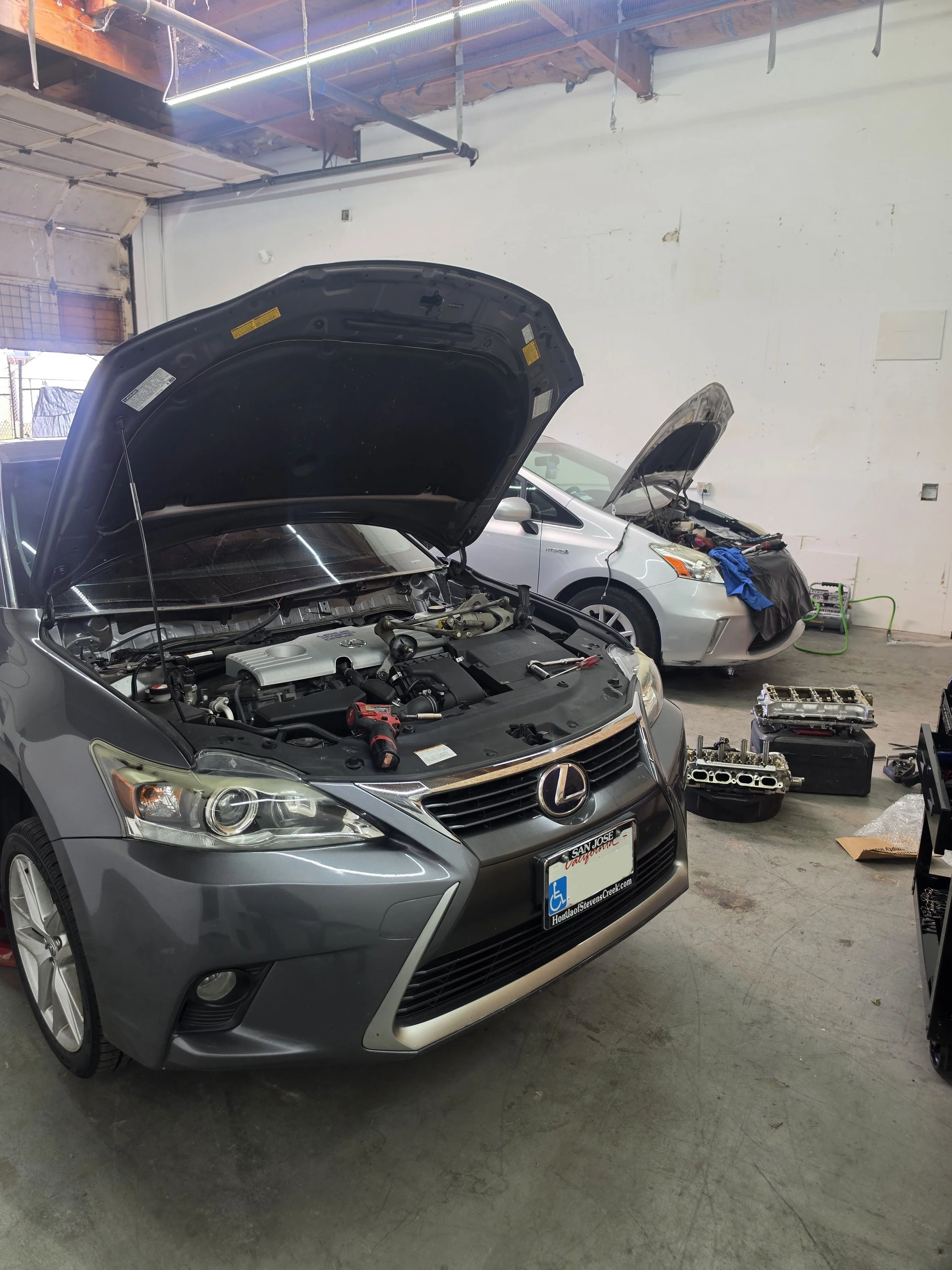 2 cars in shop.jpg