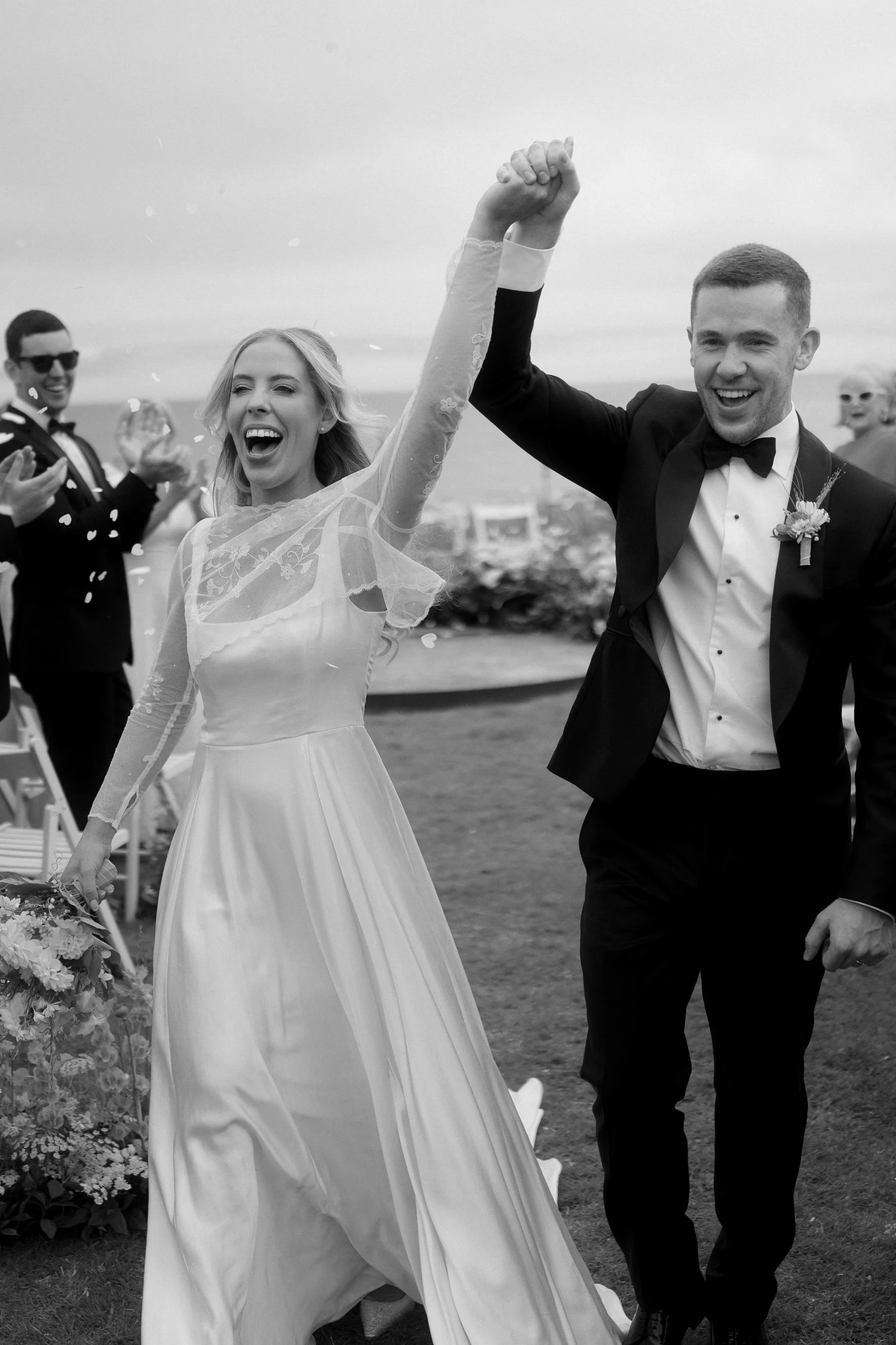 Irish bride wearing bespoke Carrickmacross Irish lace wedding topper with a custom floral design and embroidered monogram initials