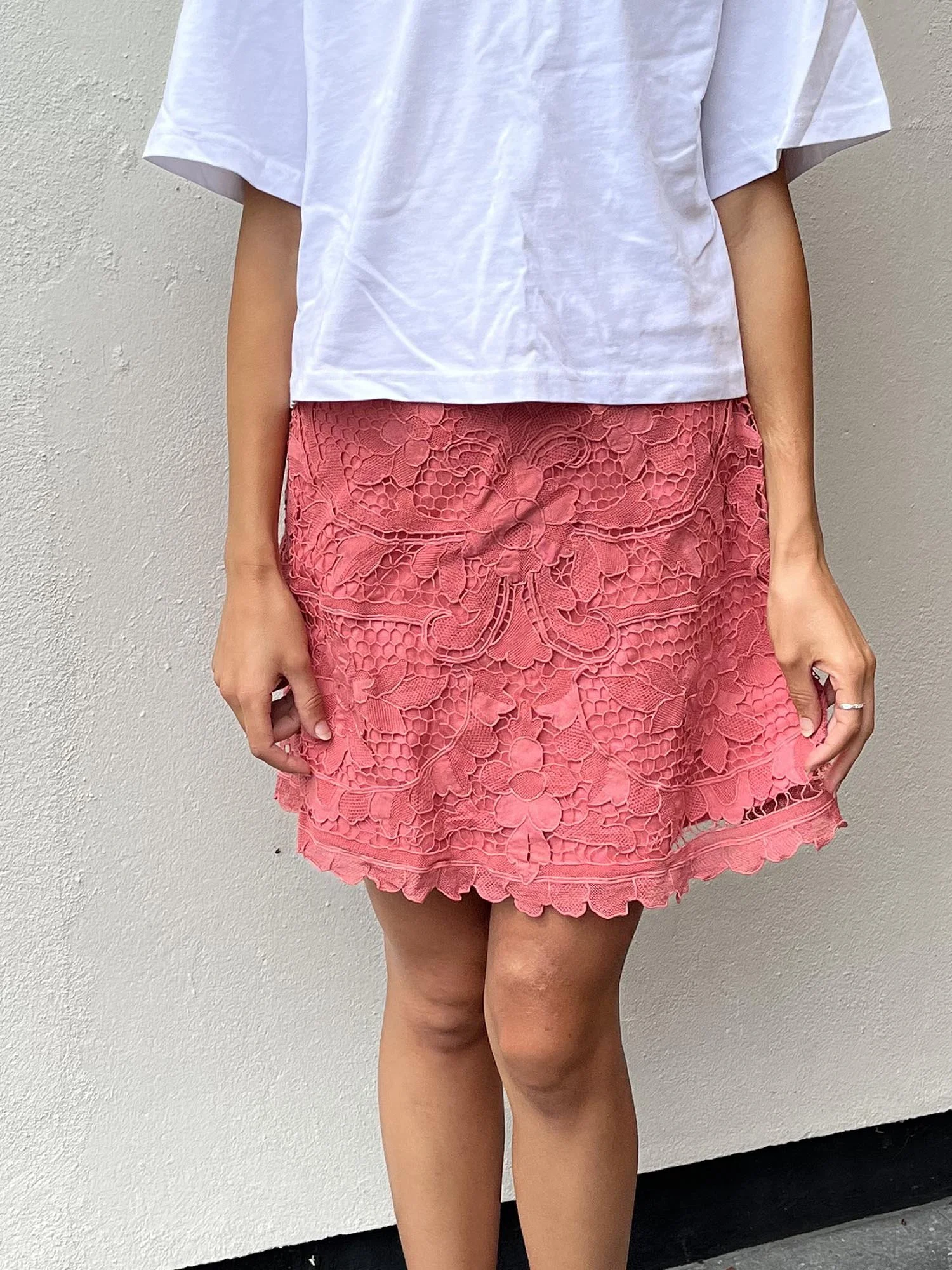Coral coloured A-line mini skirt, up-cycled from antique Madeira cutwork lace