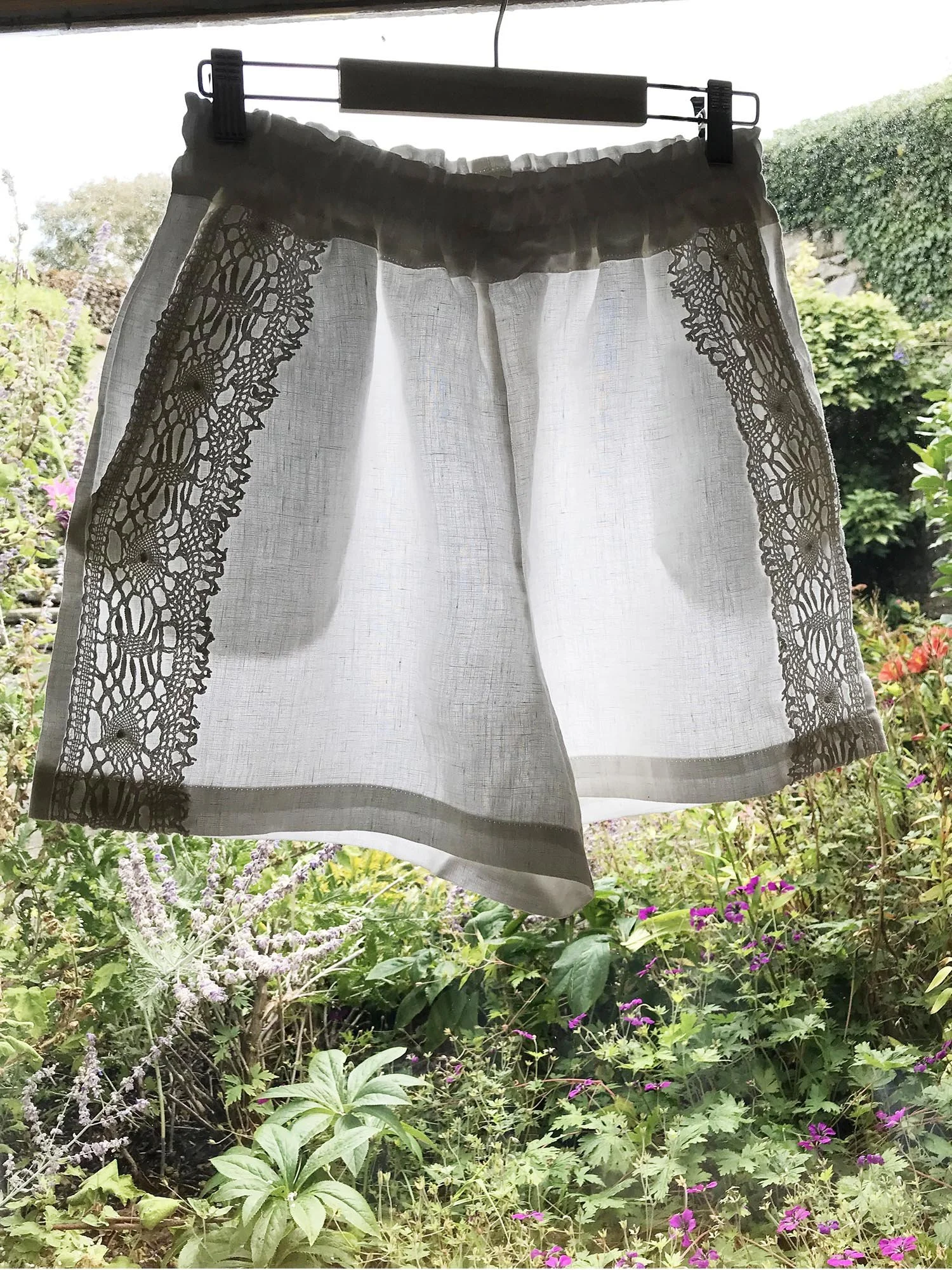 White Irish linen shorts with pockets and vintage crochet lace