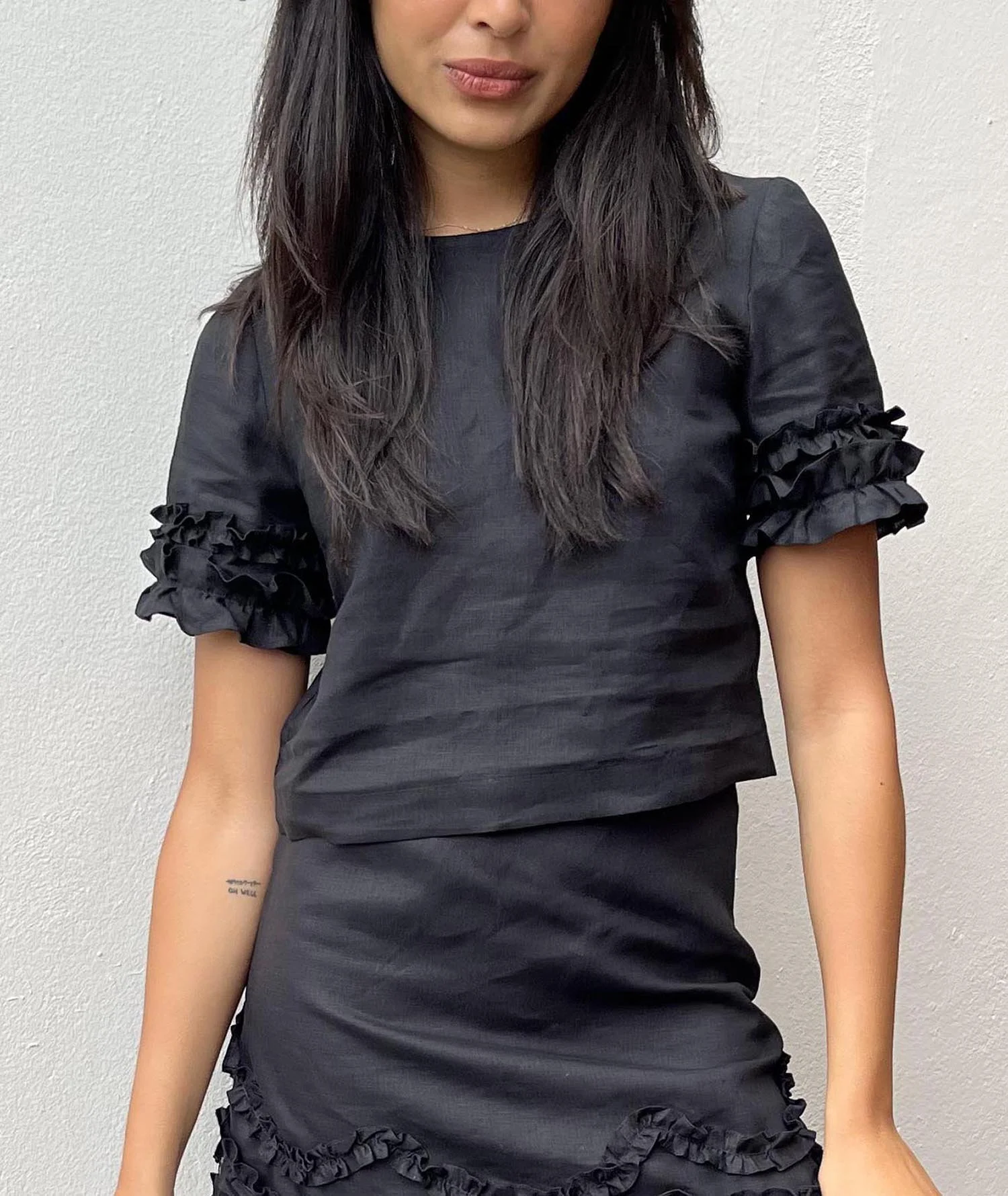 Black cropped top made from 100% Irish linen, with frills at sleeves