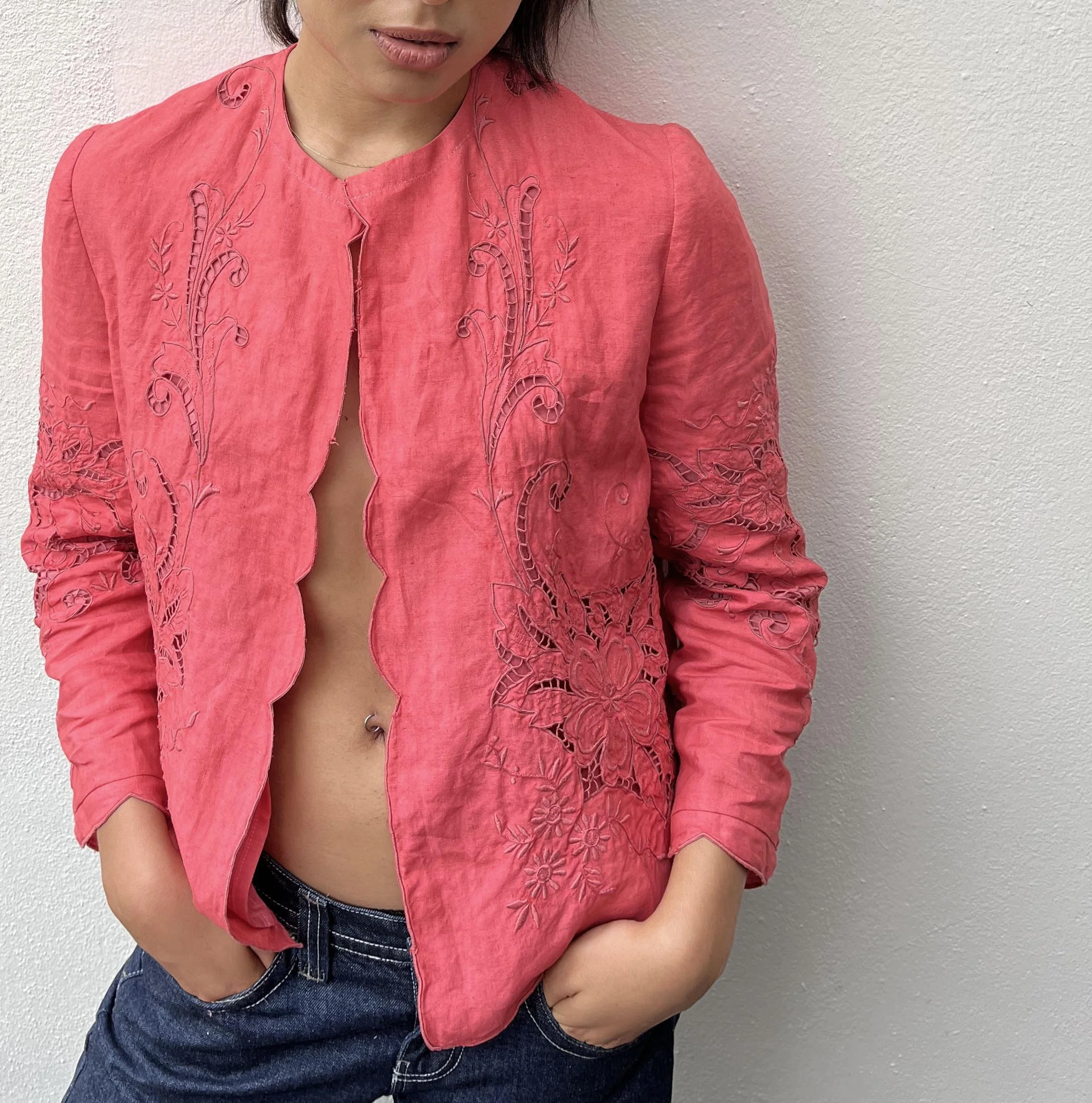 Coral coloured jacket upcycled from vintage embroidered cutwork linen textile