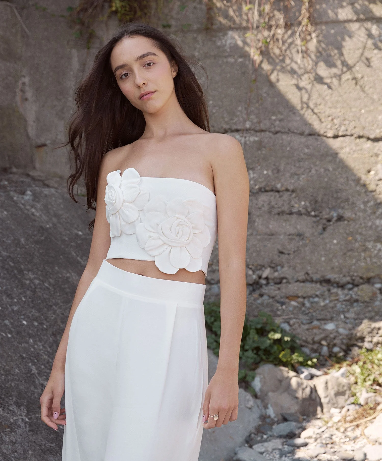 Saoirse white, crepe bridal top with 3d flower embellishment, worn with white, crepe, wide leg trouser