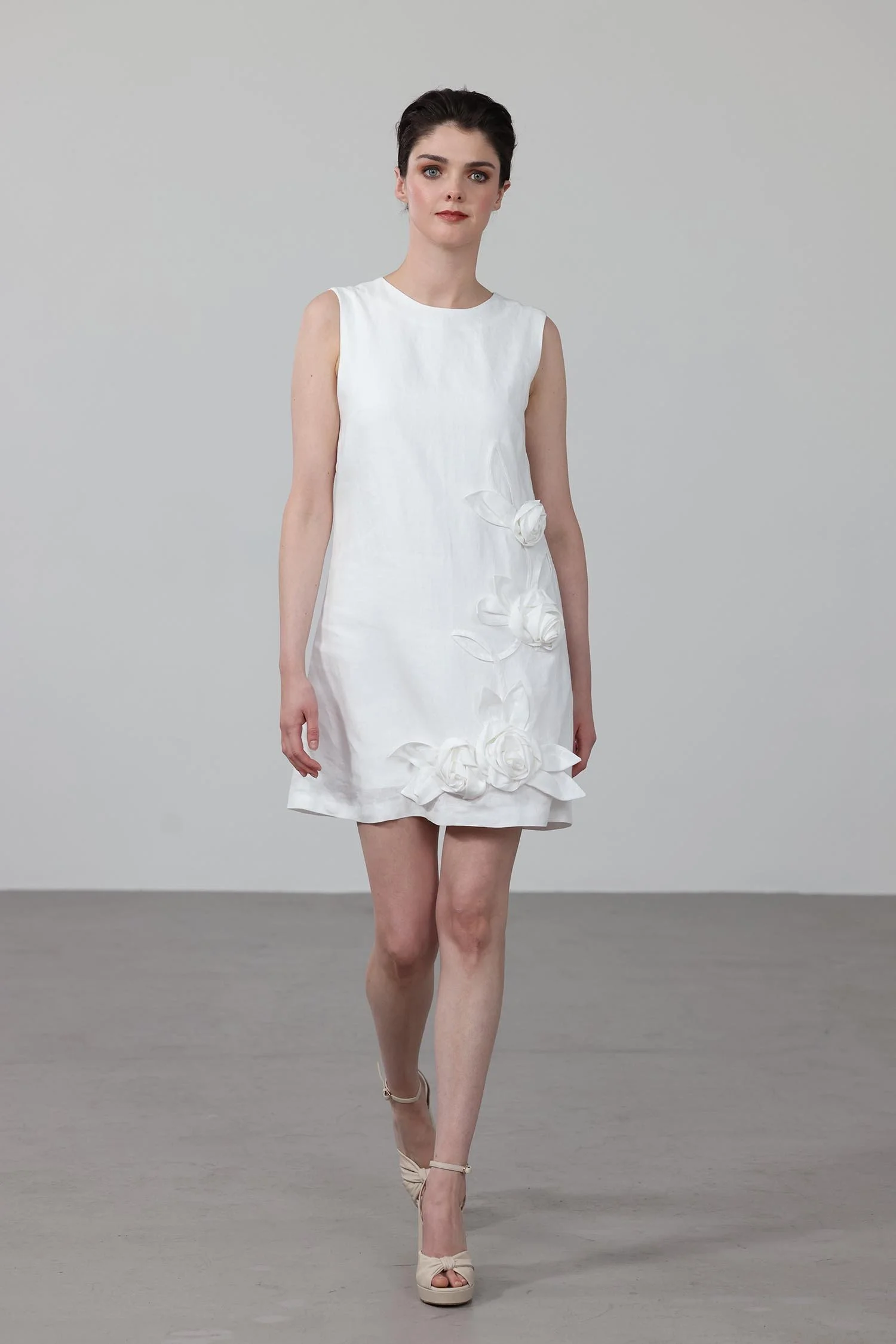 White A-line mini dress made from 100% Irish linen, with 3d flower embellishments