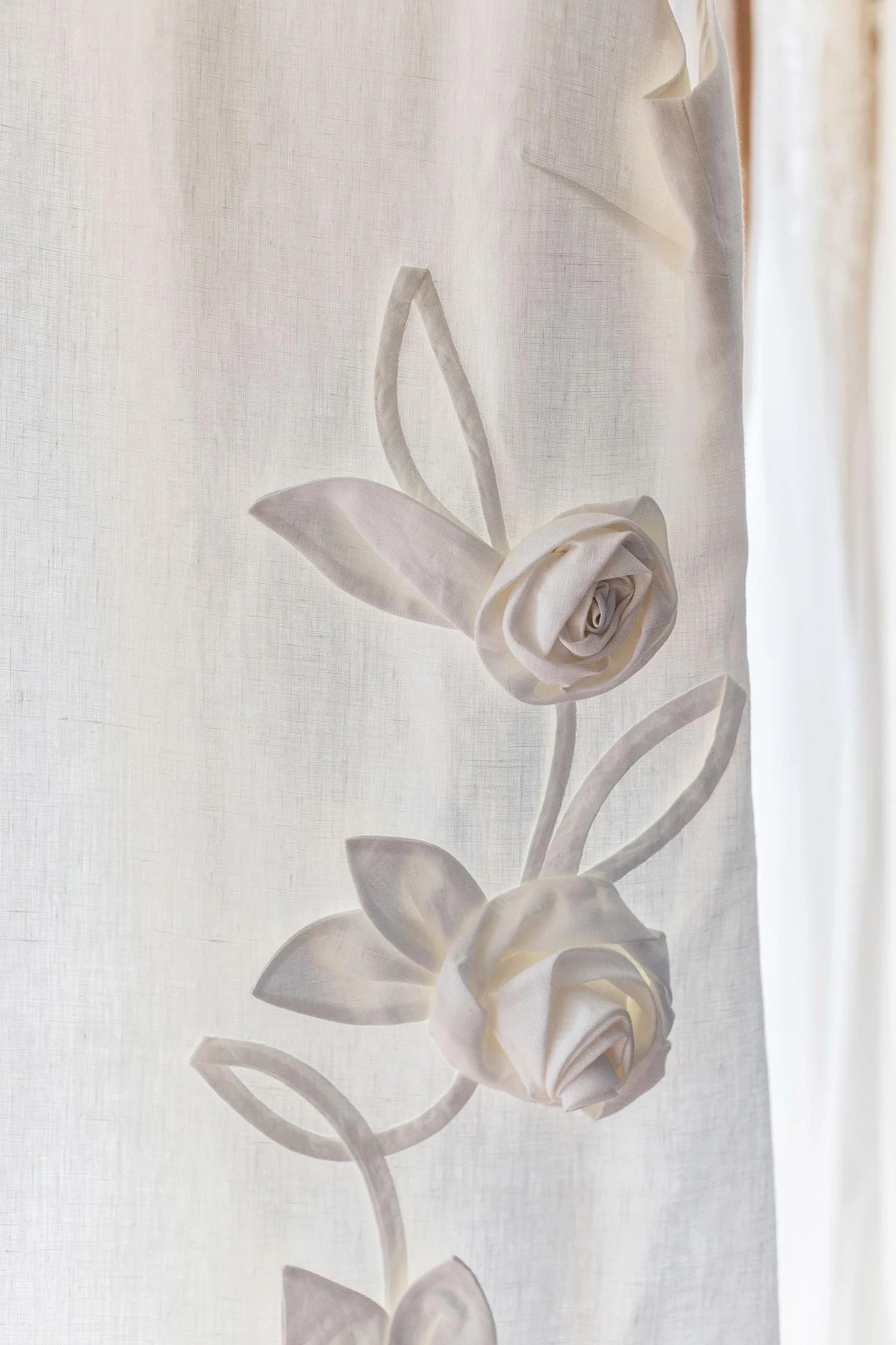 White A-line mini dress made from 100% Irish linen, with 3d flower embellishments