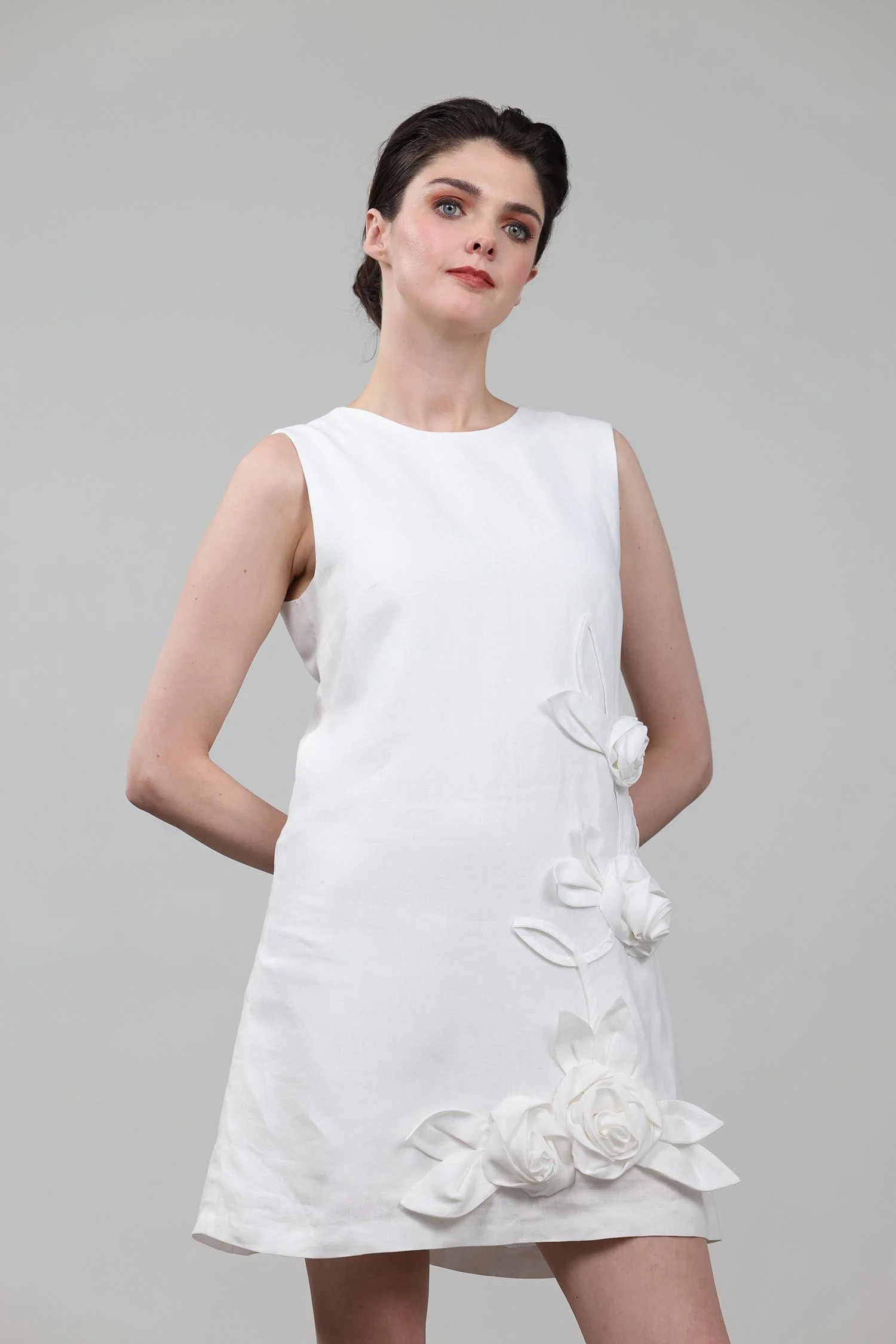 White A-line mini dress made from 100% Irish linen, with 3d flower embellishments