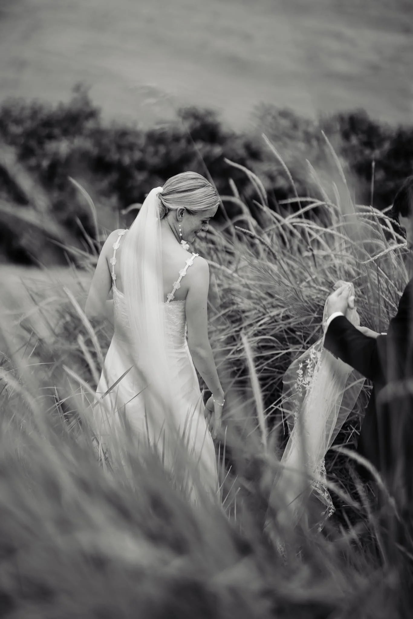 Irish bride wearing a custom Carrickmacross Irish lace wedding veil with personalised wild flower motifs