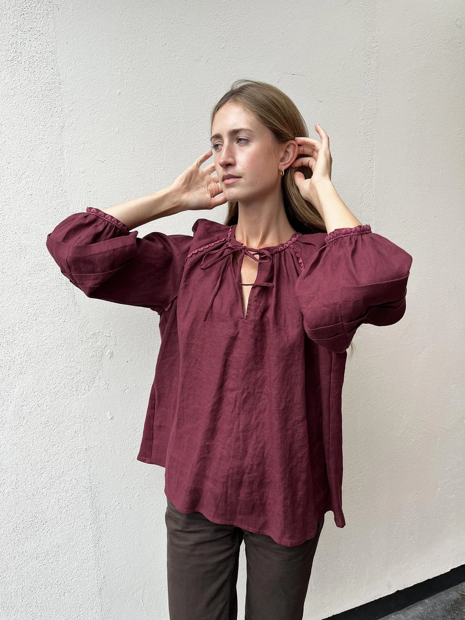 Burgundy coloured, long sleeve, Irish linen blouse with pink antique lace details and ties at front