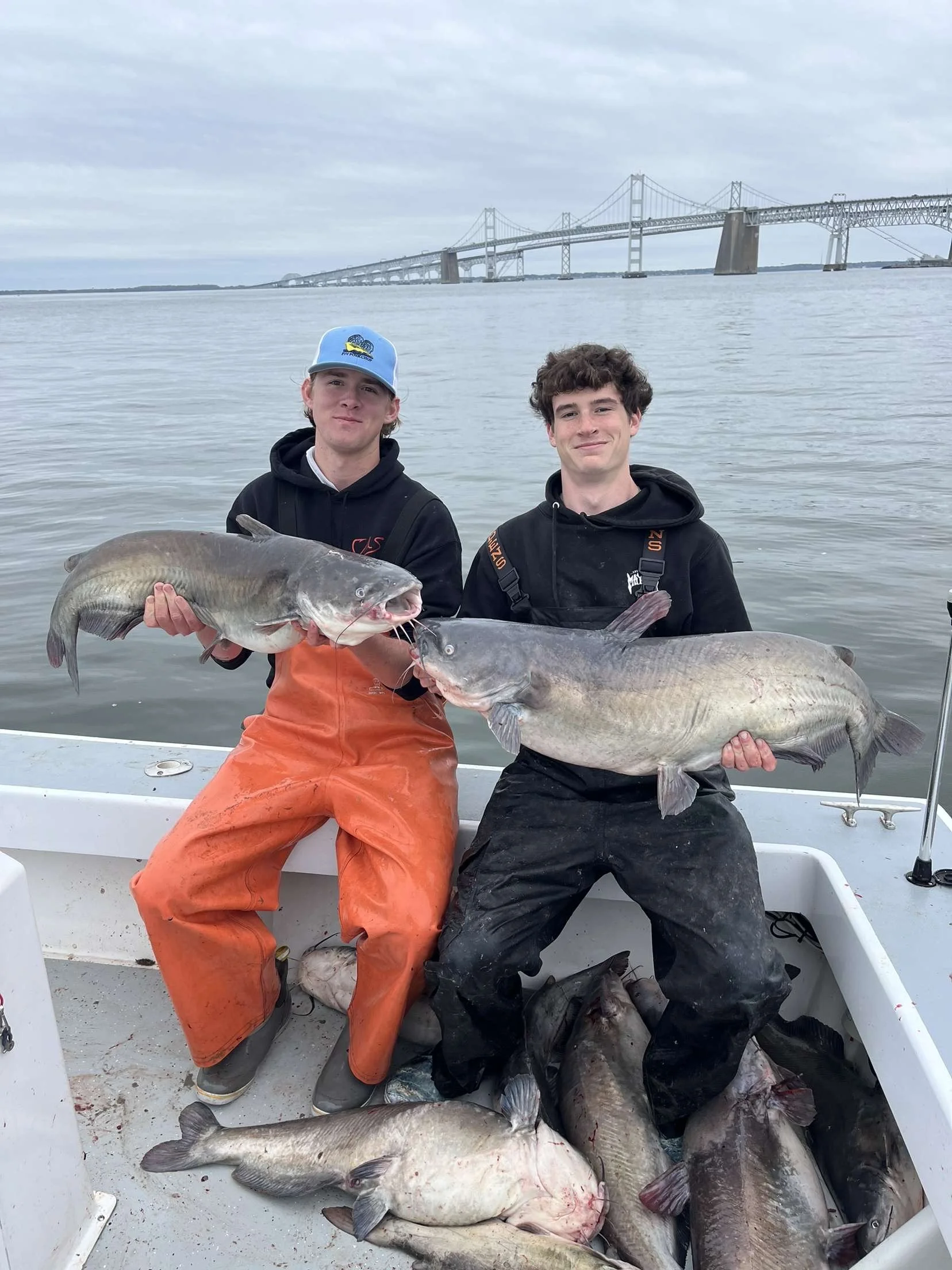 With Ben Riley Holding up two large Invasive Blue Catfish