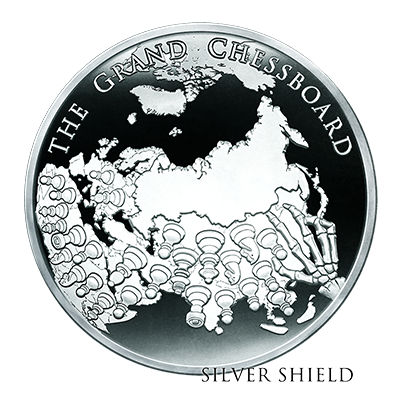 Silver coin featuring a map of Eurasia and the text 'The Grand Chessboard' and 'Silver Shield' engraved on it.