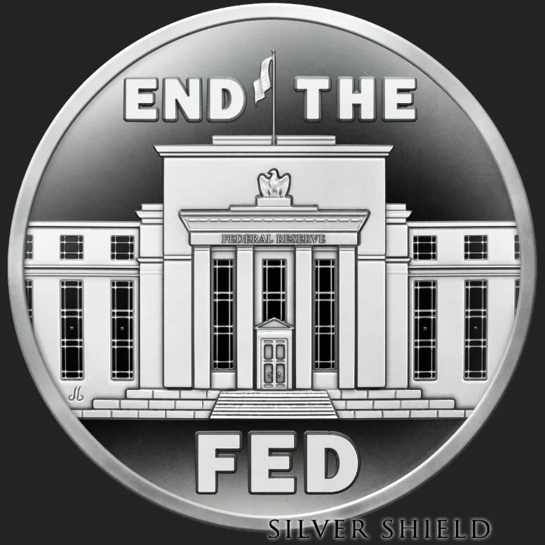 A silver coin featuring the Federal Reserve building with the words "End the Fed" on the top and "FED" on the bottom, and a small inscription "Silver Shield" at the bottom.