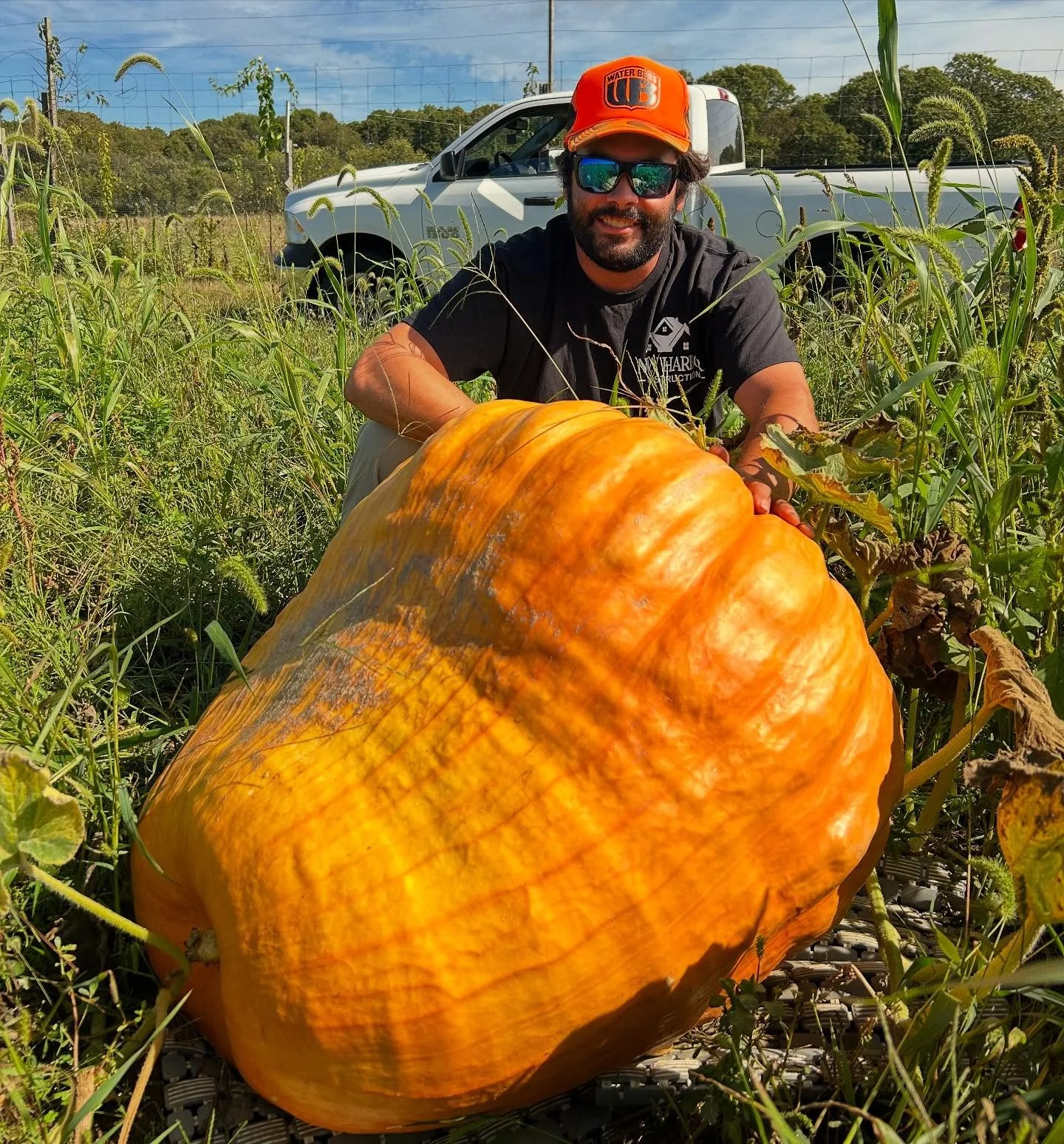We like pumpkins &lsquo;round here!!! Mikey with one of his giant pumpkins he grew this season 🎃🧡👀 Off to the @normanbirdsanctuary harvest fair she goes! We had a late start but have bigger pumpkin plans for next season! #giantpumpkin #pumpkins #m