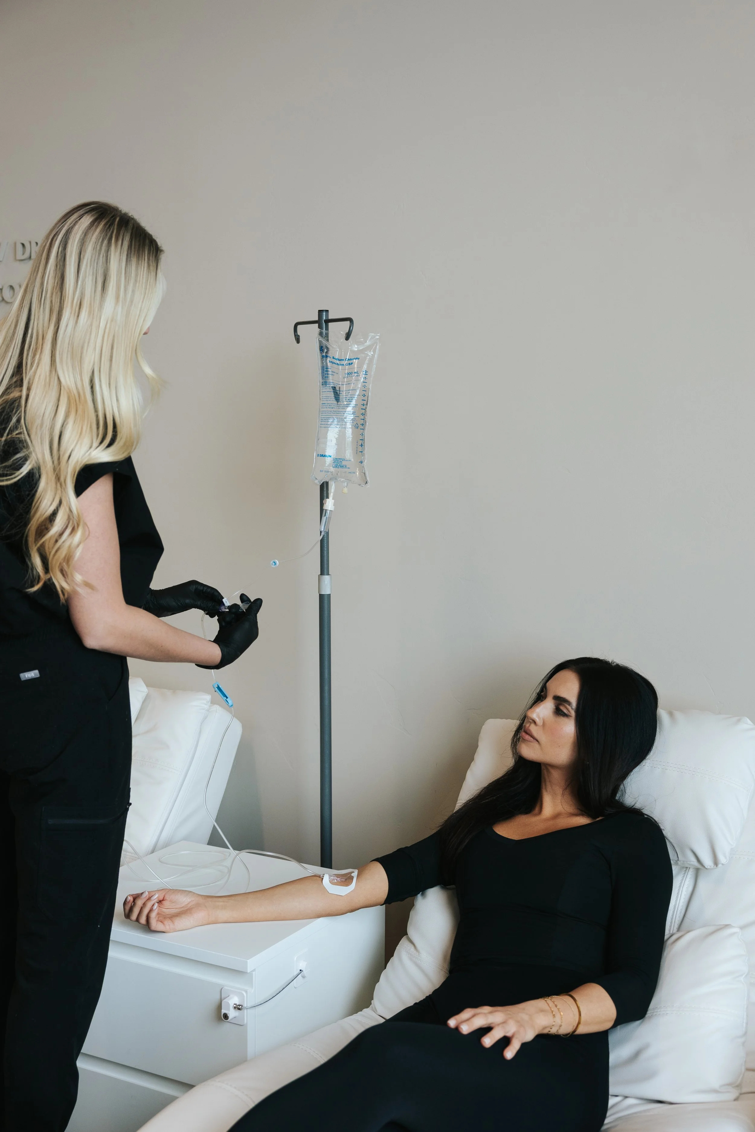 Client relaxing during IV therapy session for hydration and recovery at Deliberate Wellness Vineyard UT.