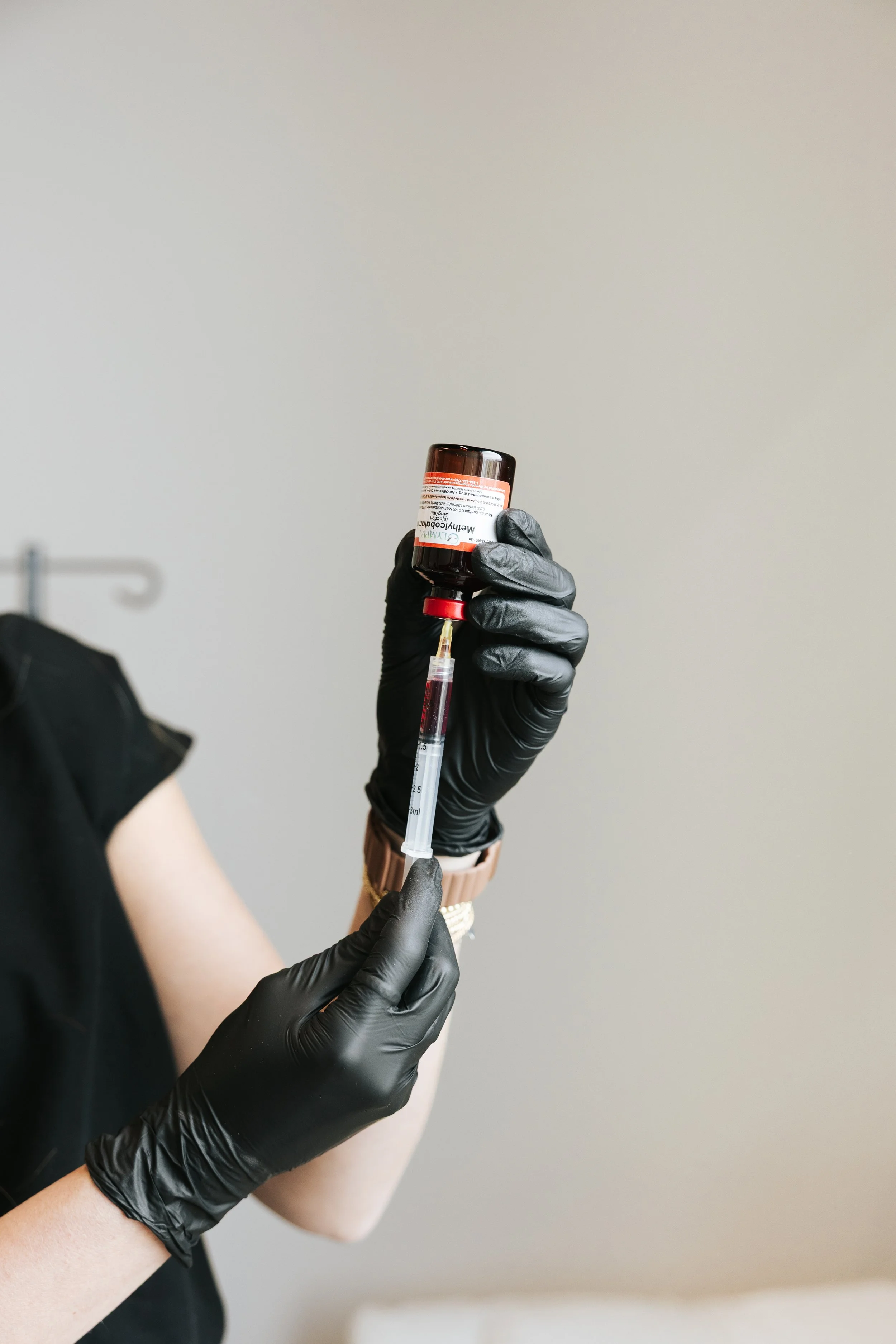 Licensed nurse preparing sermorelin peptide therapy at Deliberate Wellness in Vineyard Utah