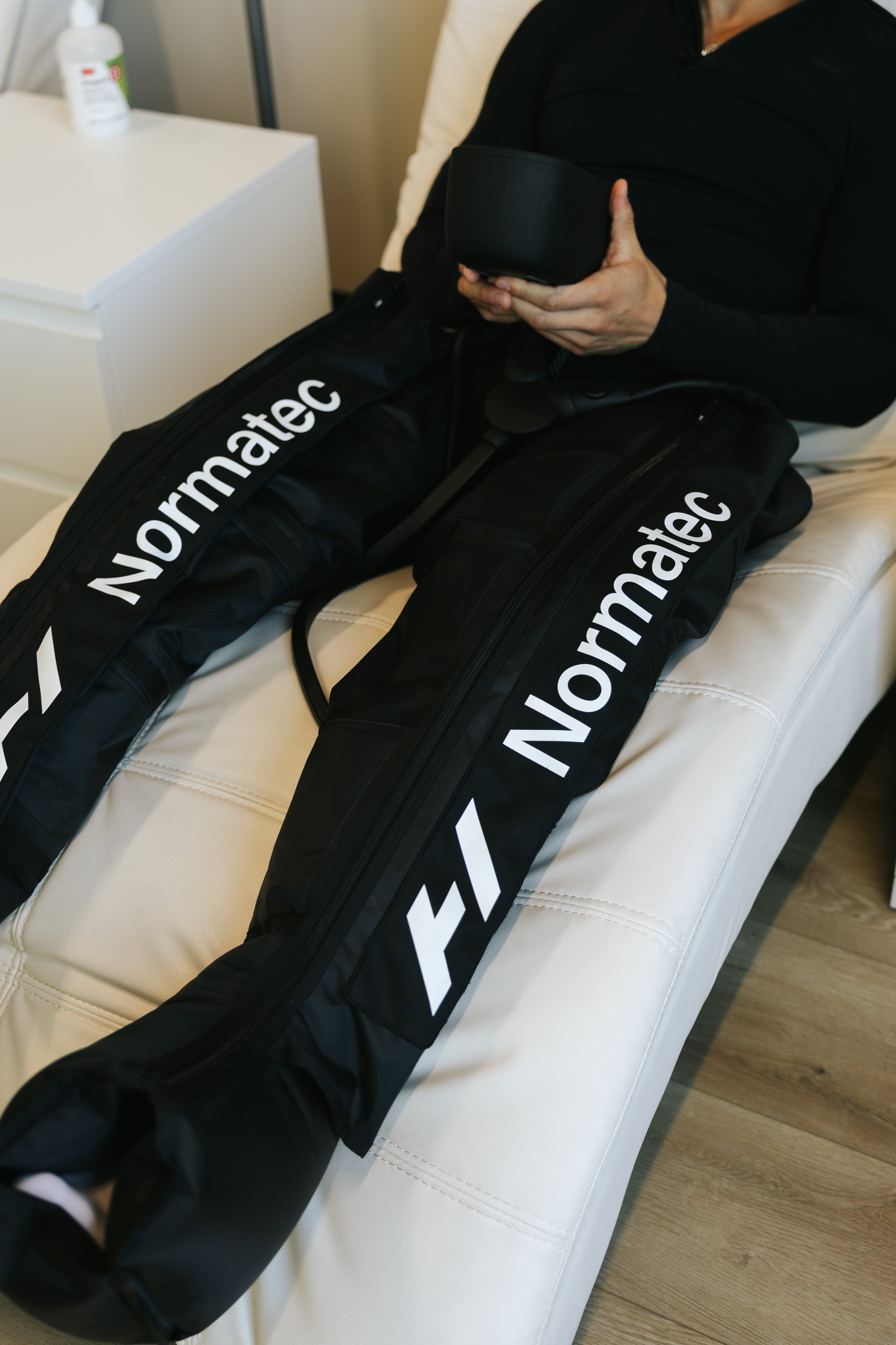 Compression therapy boots improving circulation and recovery at Deliberate Wellness near Orem Utah