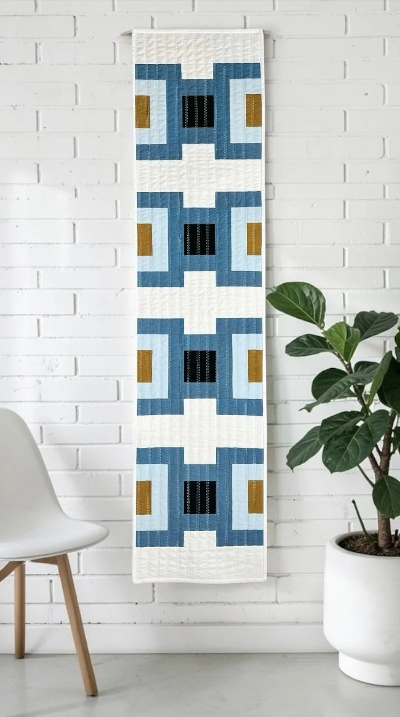 Modern geometric wall hanging made with the Cruce Quilt Pattern, perfect for stylish DIY home decor - PDF Download Pattern by Kelli Fox Designs
