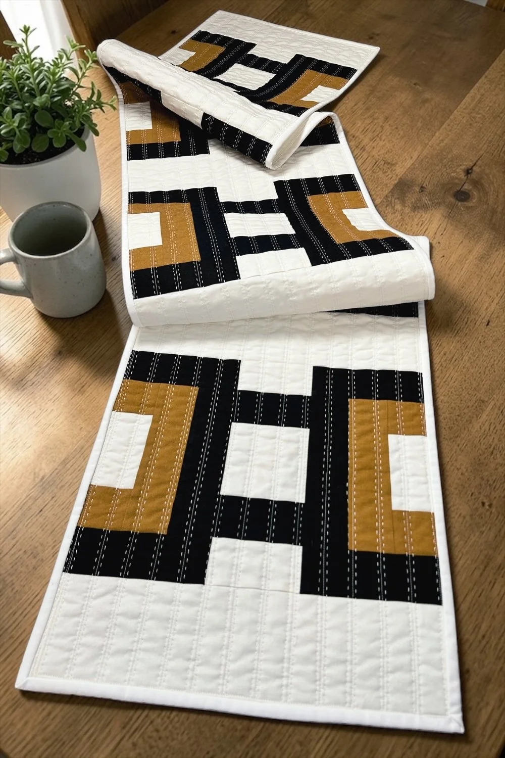 Cruce modern table runner quilt pattern by Kelli Fox Designs, an easy strip-pieced design that comes together quickly