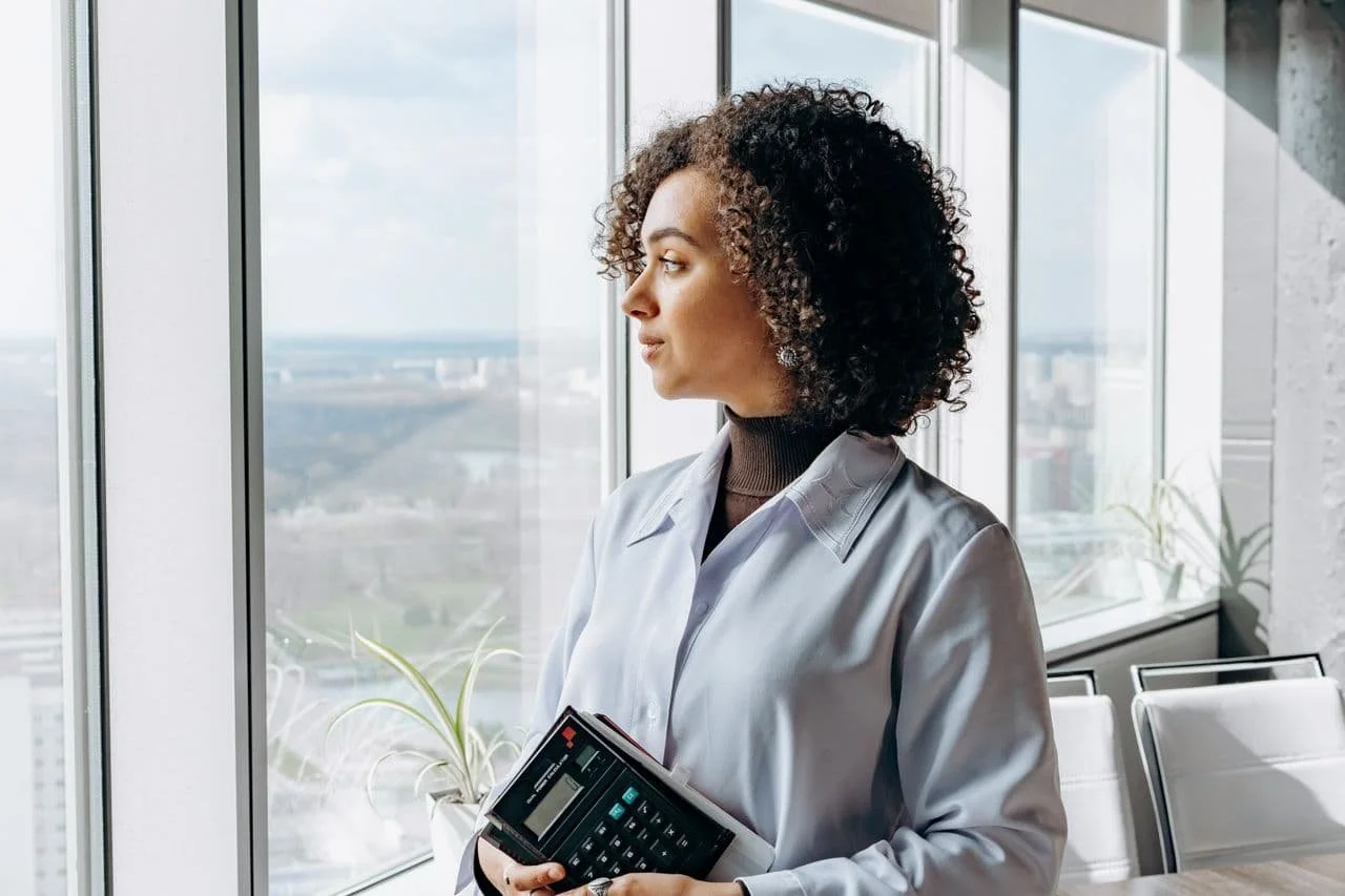 a-woman-looking-outside-the-window