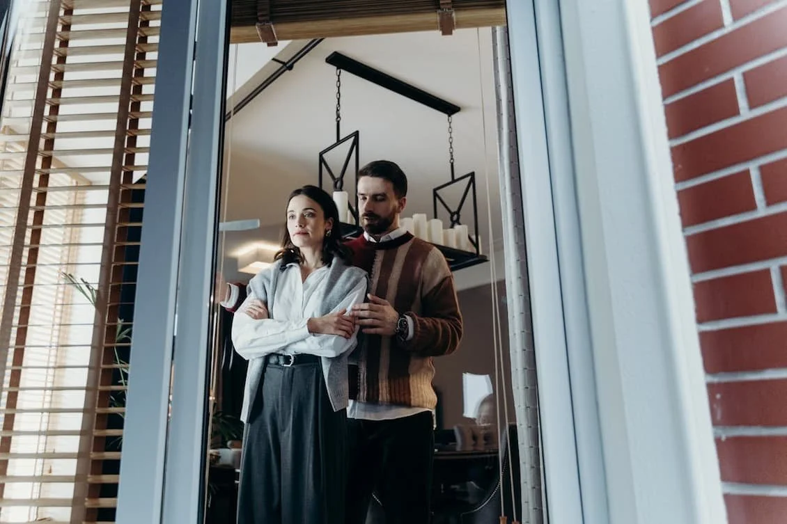 a-man-holding-a-woman-from-behind