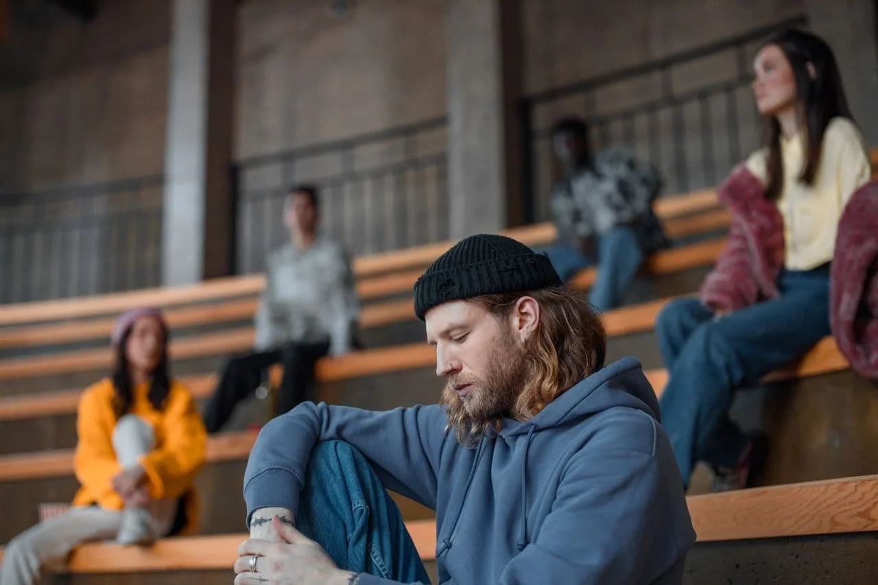 man-in-blue-hoodie-and-black-knit-cap