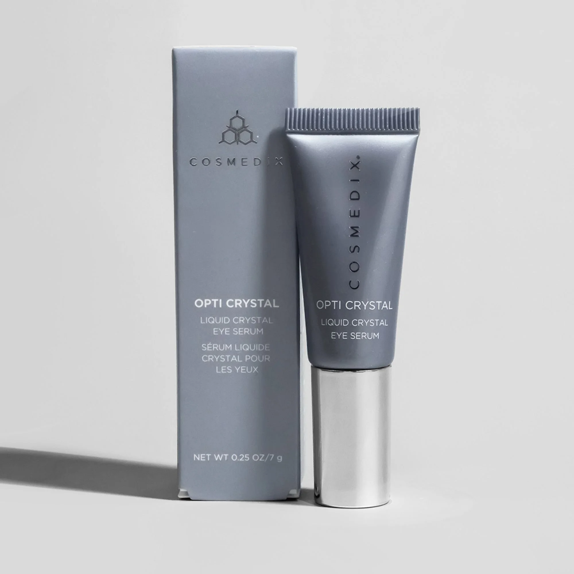 COSMEDIX Opti Crystal eye serum displayed beside its original product packaging.