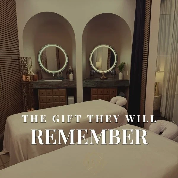 Two prepared massage tables at LUX MedSpa Brickell, with the words ‘The gift they will remember.’