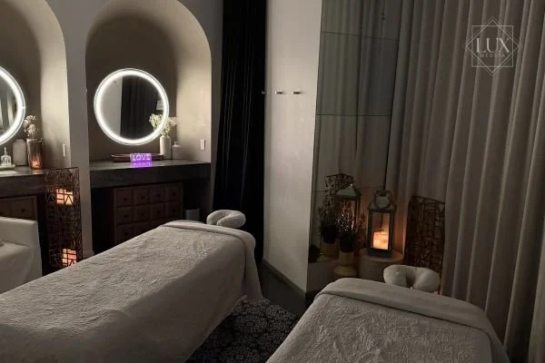 Private couples massage room at LUX MedSpa Brickell prepared for two guests enjoying a shared spa experience in Miami