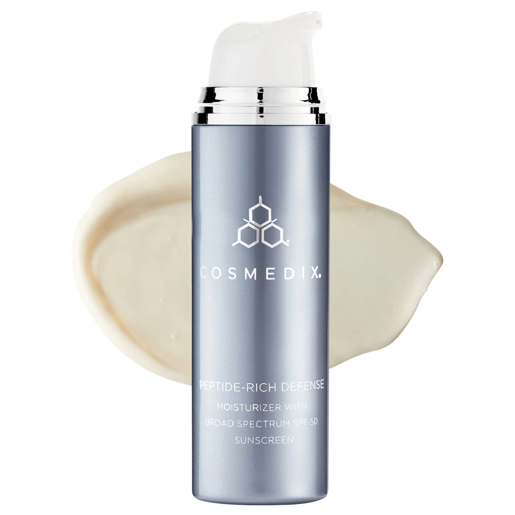 A bottle of COSMEDIX Peptide-Rich Defense moisturizer shown over a creamy, textured swatch of the SPF 50 product.