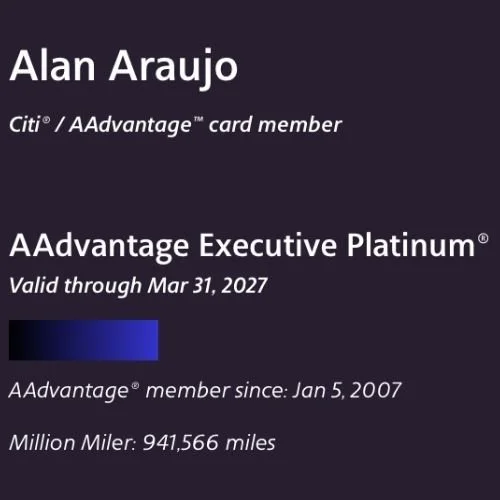 Alan Araujo, founder of LUX MedSpa Brickell, holding an American Airlines million-miler card representing decades of international travel experience