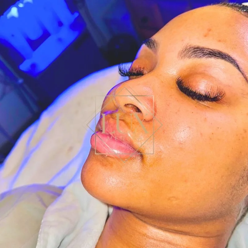 Client glowing after a custom facial at Lux MedSpa Brickell — Best Spa in Miami for facials and massage