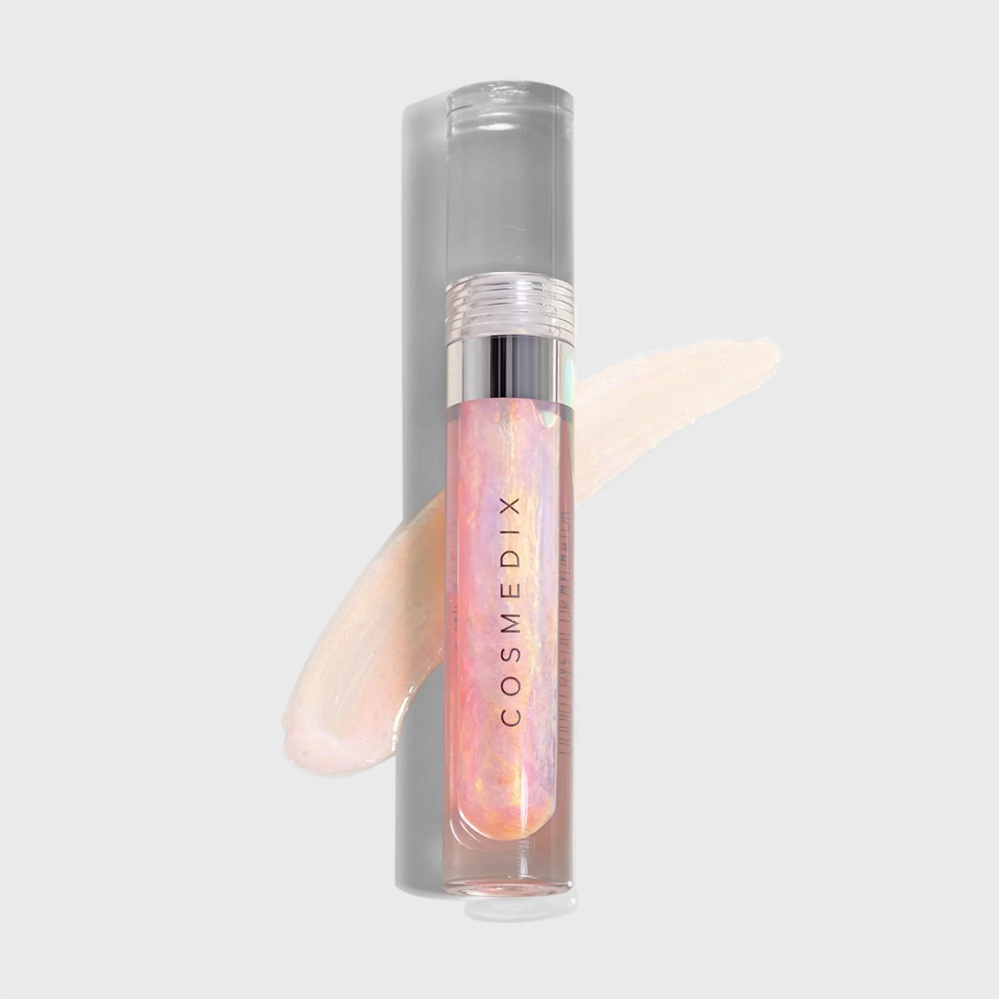 Lumi Crystal lip hydrator tube showing its iridescent pink and pearl-colored finish.