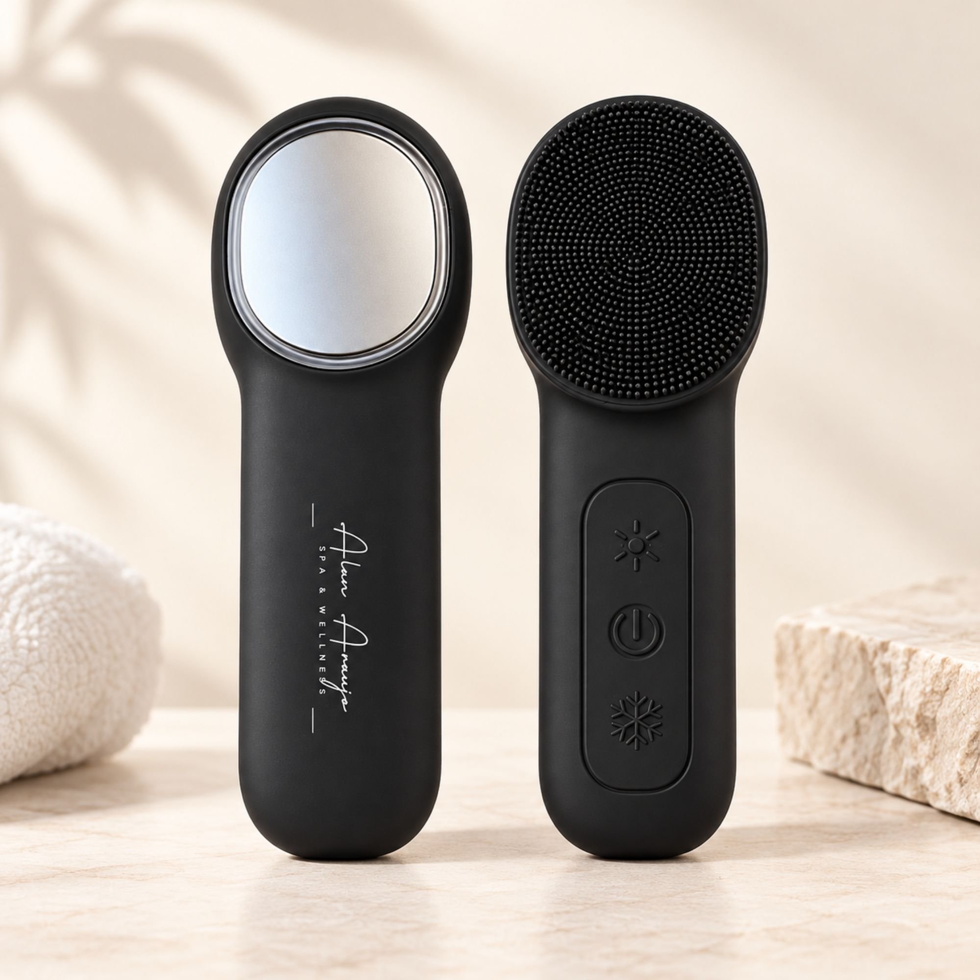 Two black spa and wellness skincare devices showing LED light therapy modes, one glowing blue and the other glowing red, placed side by side on a wood background.