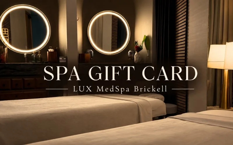 Two massage tables and softly illuminated mirrors, with the words Spa Gift Card — LUX MedSpa Brickell.