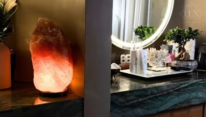 Aesthetic treatment room at LUX MedSpa Brickell with Himalayan salt lamp and COSMEDIX skincare products in Miami