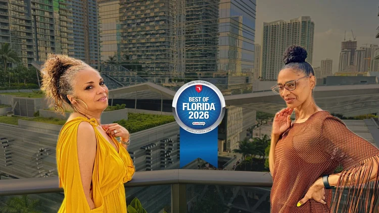 Two women overlooking Brickell, with a TodayUS 2026 Best Spa Destination in Miami award graphic for LUX MedSpa Brickell.