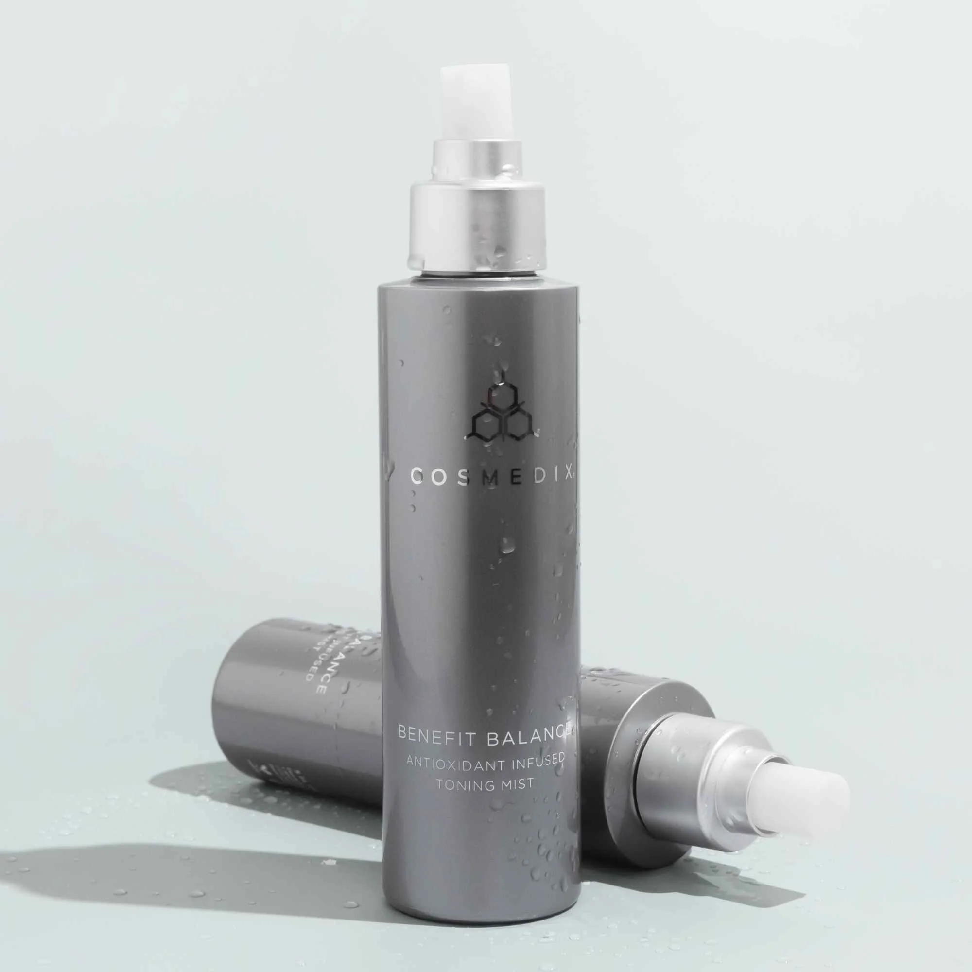 Two bottles of COSMEDIX Benefit Balance Antioxidant Toner displayed together.